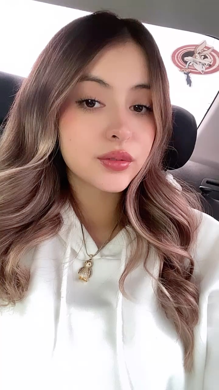 Girl waving hello on a video call preview
